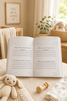 inside a nursey with To My Unborn Child journal open