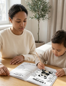 Mother and Son coloring together on I Am Like An Animal with a plant in the background
